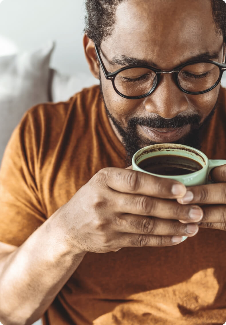 Man enjoying coffee at home
